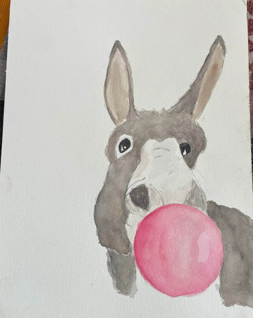 Watercolor painting of a donkey blowing pink bubblegum